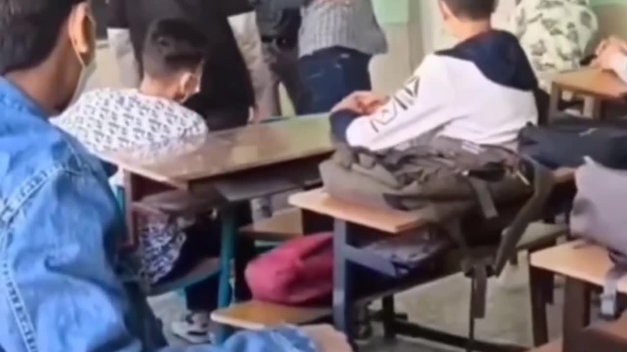 Teacher gets attacked by student in Iraq and reacts appropriately.