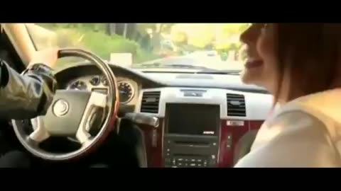 Lesbian driving kissing in car