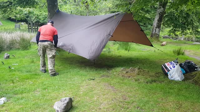 Taking down the DD hammocks 4x4 tarp. Riverside wildcamping