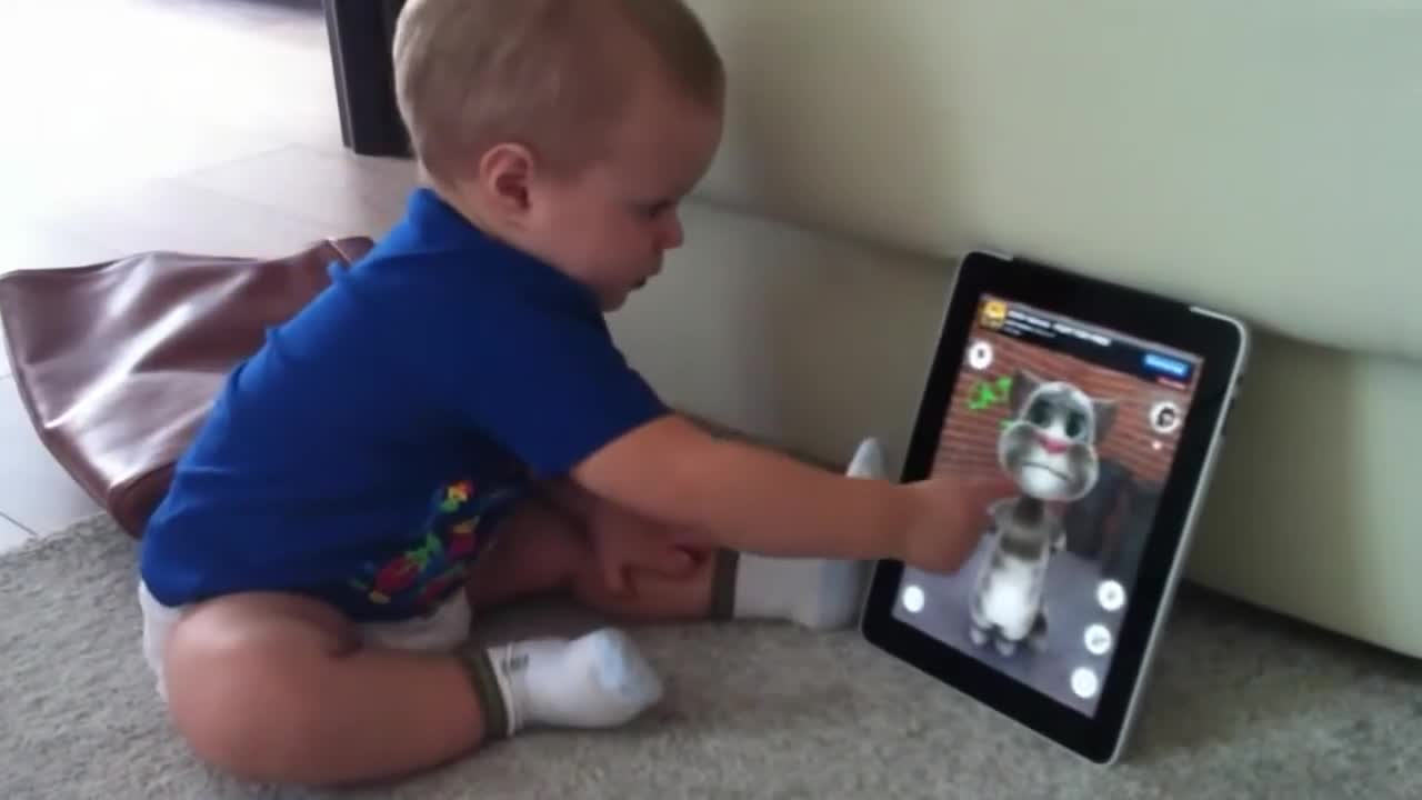 A child talks to a cat