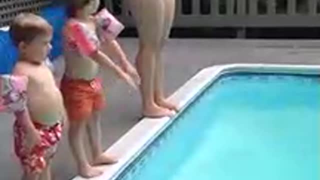 Child Performs Spectacular Belly Flop Into Pool