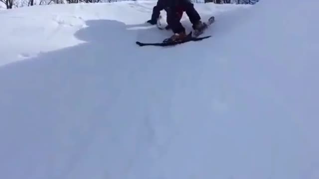 Cute kid snowboarding