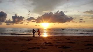 Sunset over the sea with clouds