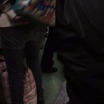 Woman carrying bag full of potatoes