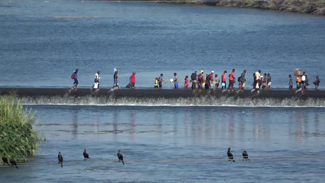 Haitians Cross Back and Forth Over Texas Mexico Border