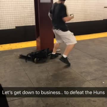 Guy white shorts black shirt karate kick subway pole