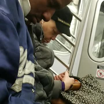 Man asleep in blue jacket snot coming out of nose