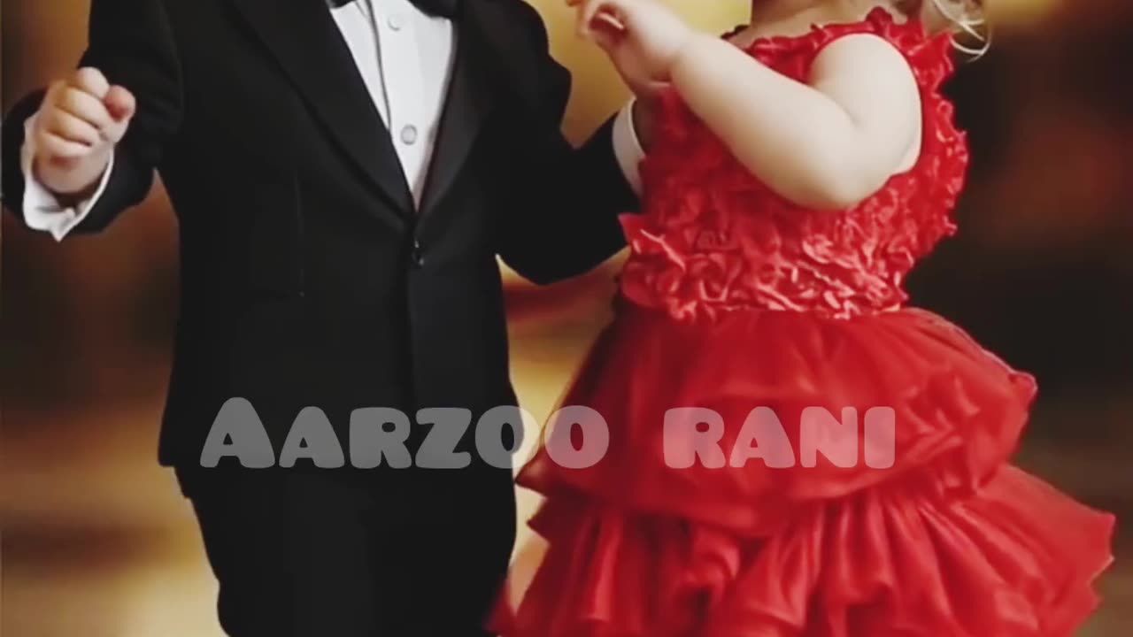 Baby girl and baby boy dance