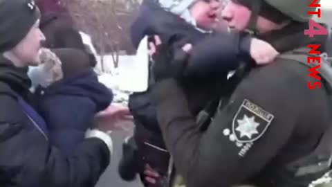 Ukrainian police officer says goodbye to distraught Son
