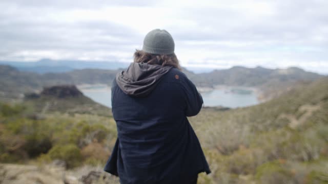 Back View of a Man Taking Pictures of the Nature