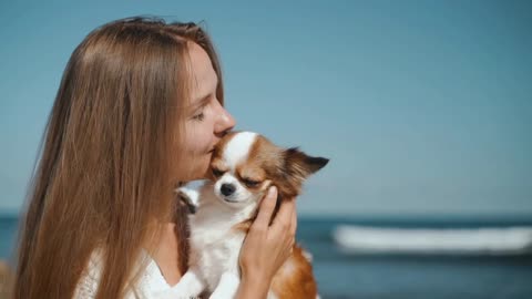 Young adult girl spending weekend day with little dog