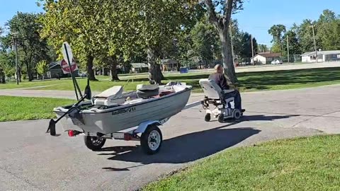 Man Pulls Boat With a Motorized Chair