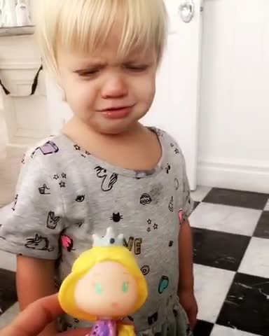 Little Girl Knocks Doll Out Of Mom's Hand Every Time She Sings Disney Songs
