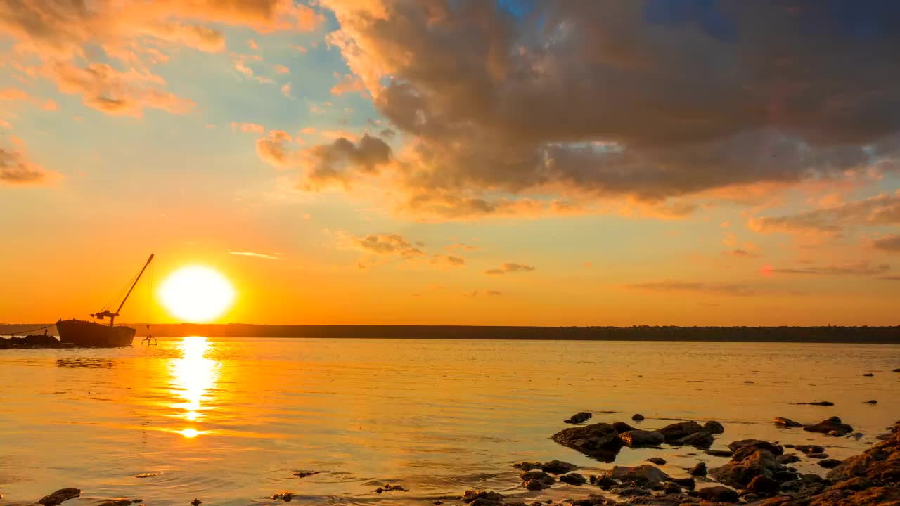 Sunset in the river with a boat