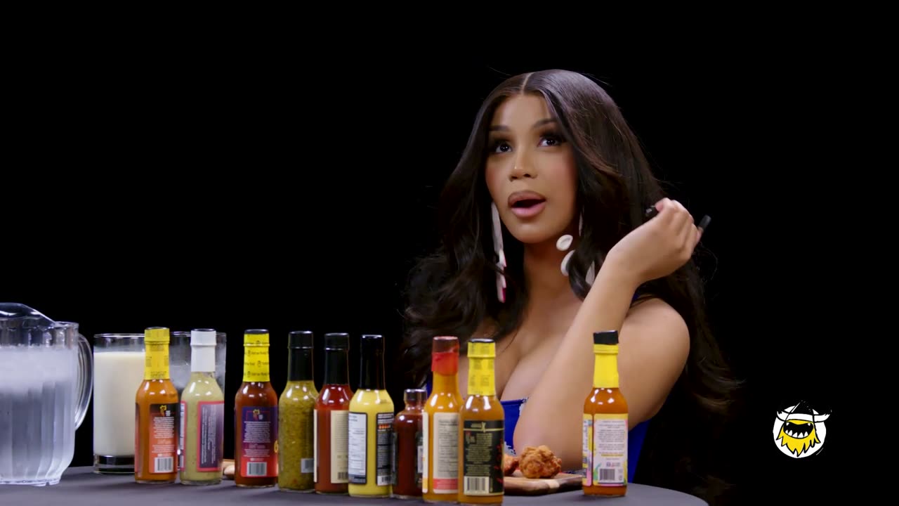 Cardi B Tries Not to Panic While Eating Spicy Wings