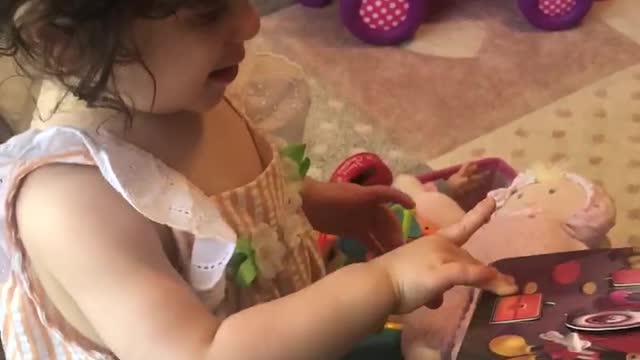 Playing and reading in her room