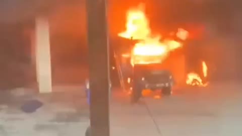 Military Infantry Vehicle Seen On Fire Outside Someone's Home