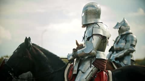 A man knight in the armor riding a horse - another knight comes next to him