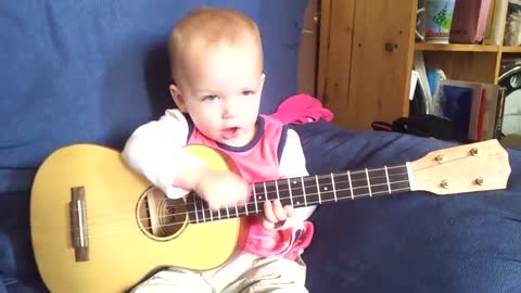 Baby Singing and Playing Ukulele