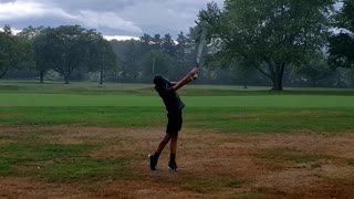 Golfing in the rain.