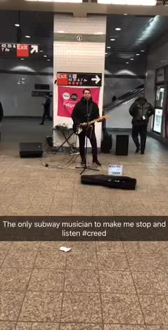 Musician playing creed in the subway station