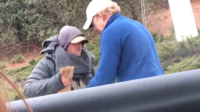 Man Gives Coat Off His Back To Homeless Man