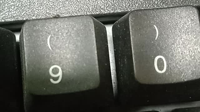 a very small spider on my keyboard / baby spider