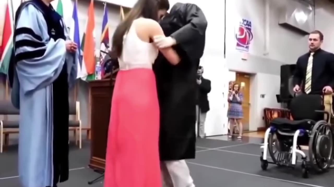 She helped her paralyzed boyfriend stand up to get his degree