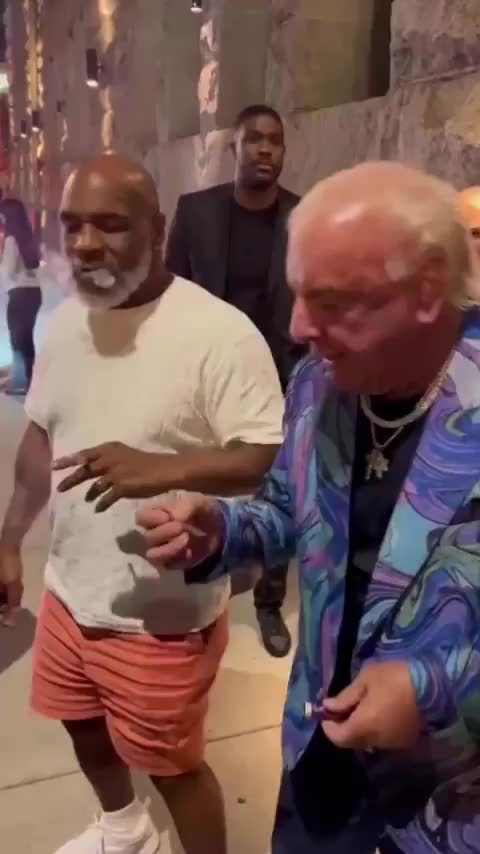 The Nature Boy Ric Flair smoking with Mike Tyson
