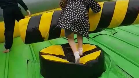 Girl in black and white jacket on black yellow game