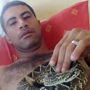 man sleeps with a rattlesnake!!