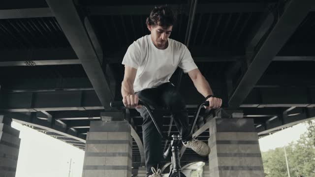 Man Doing a Stunt with His Bike