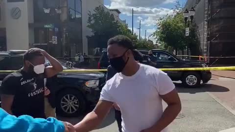 Joe Biden poses with Black Lives Matter protester in Wilmington Delaware