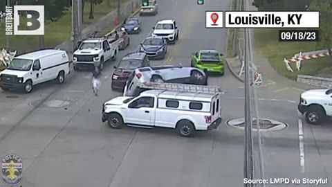 GO TEAM! UNIVERSITY OF LOUISVILLE FOOTBALL PLAYERS HELP FLIP OVERTURNED CAR
