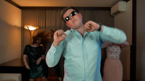 Group of young people dancing indoors