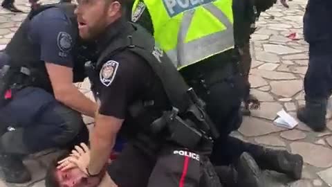 Ottawa police aggressively arresting people.