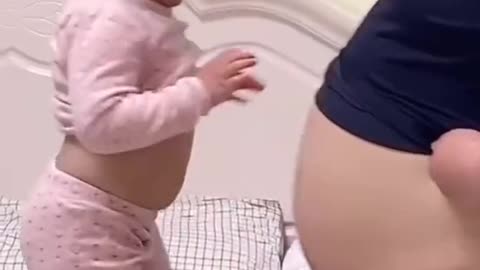 Look father and daughter are very similar. Baby is copying what parents doing and look like.