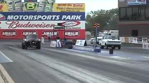 Wheelstanding Henry J Gasser of Derrick Nowe at Blue Suede Cruise GoodGuys Drags 2008