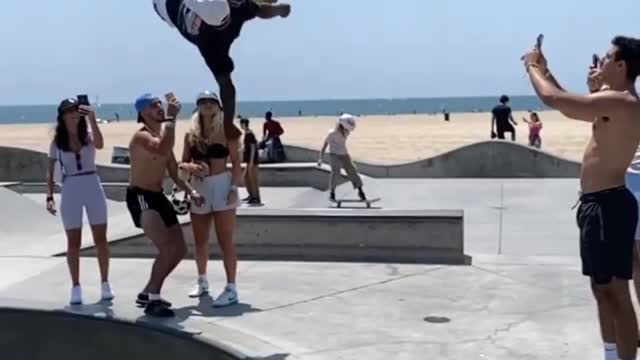 Showing off his best rollerskate backflip