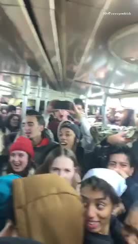 Pt. 2 party on subway train, guy says yeah through microphone