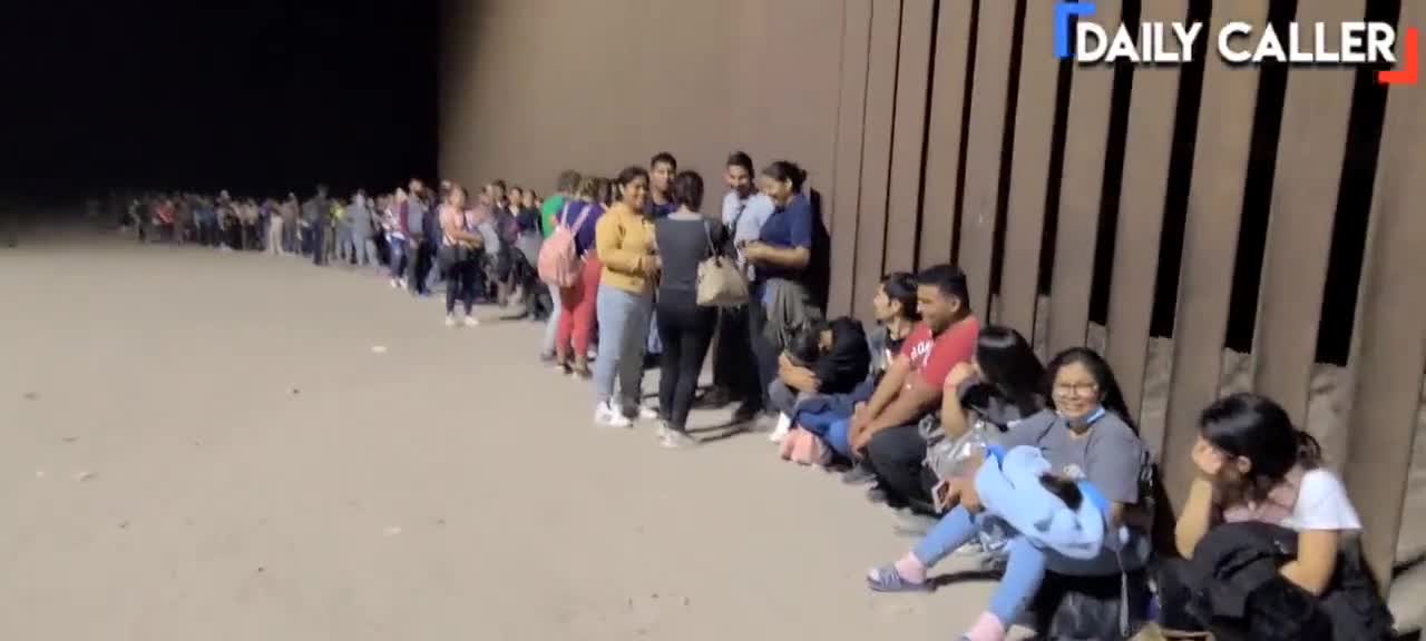 Migrants Converge On The Arizona Border In Lines As Far As The Eye Can See