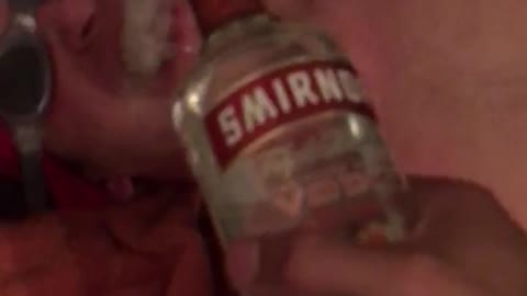 Shirtless guy getting drink spilled on face