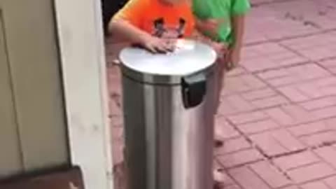 Kids Jokingly Hit Each Other With Trash