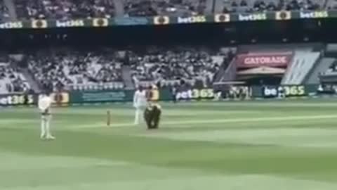 MCG MELB AUS - Man runs on the ground with, we do not comply on his back