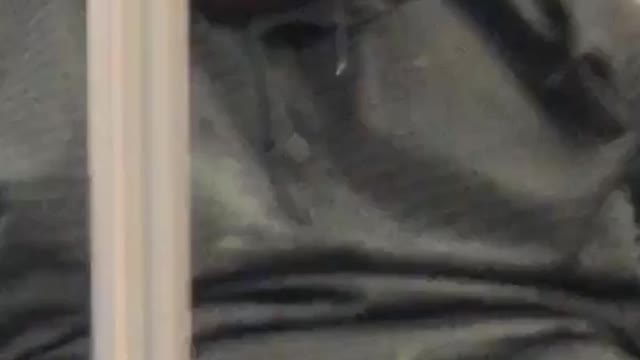 Man asleep in grey shirt has snot coming out of nose