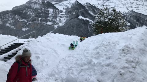 The children sledding.