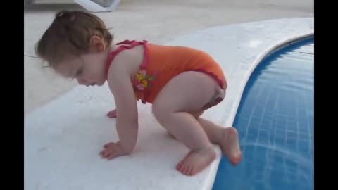 Toddler swimming in a pool