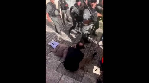 Israeli Cop Knocks Out Old Musliim Guy