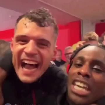 Granit Xhaka and Jeremie Frimpong celebrating Bundesliga title