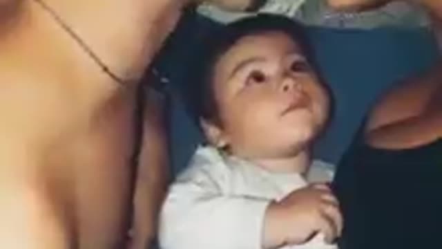 Cute baby reaction to his father and mother love